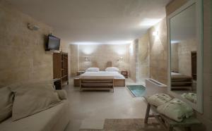 Voodi või voodid majutusasutuse L'Hotel In Pietra toas
