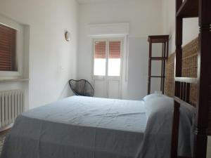A bed or beds in a room at Villa Mattera