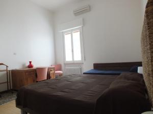A bed or beds in a room at Villa Mattera