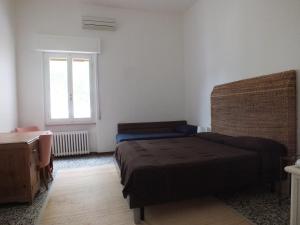 A bed or beds in a room at Villa Mattera