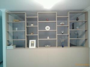 a large book shelf in a room at Izmir Apartment in Baku +21 photos