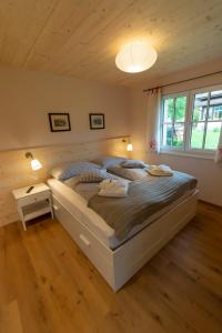 a bedroom with a large bed in a room at Chalet 164 in Bad Goisern
