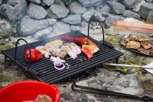 a grill with a bunch of food on it at Konoba in Cetinje