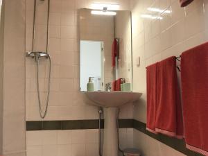 a bathroom with a sink and a mirror at Casa da Muralha Cerveira in Vila Nova de Cerveira +50 photos