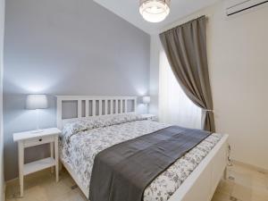 Postel nebo postele na pokoji v ubytování Il canto delle Sirene