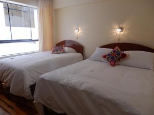 Voodi või voodid majutusasutuse Hawka Inka Hostal - Cusco toas