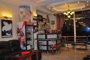 a living room with a bar in the middle of it at Hotel Austin in Constanţa