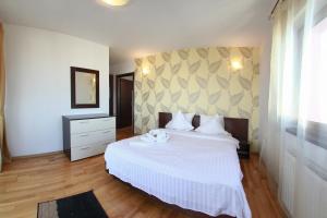 Кровать или кровати в номере Monte Carlo Palace Suites
