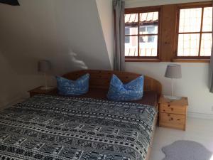 Säng eller sängar i ett rum på Klosterhäuschen in Stralsund
