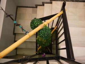 a spiral staircase with green plants on it at Hotel Maravillas del Mundo in Calpe