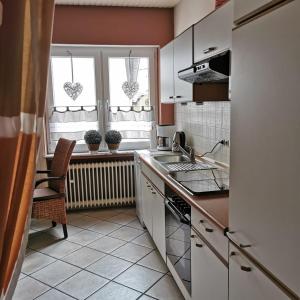 a kitchen with a sink and a window at Ferienwohnung Mosel in Valwig