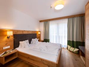 Rúm í herbergi á Hotel Kitzspitz