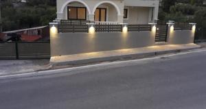 a house with lights on the side of a street at STERNES house in Agios Leon