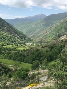 a view of a valley with mountains in the background at Acogedora casita en el Pallars in Isil