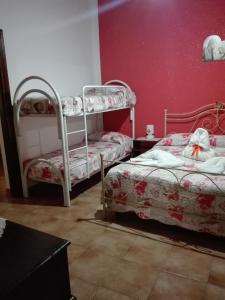Postel nebo postele na pokoji v ubytování Le Case di Zia Palma