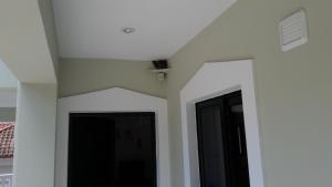 a room with white walls and a ceiling at STERNES house in Agios Leon