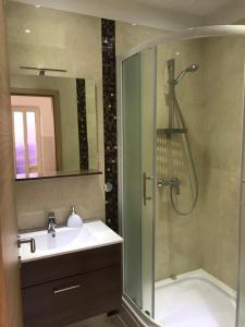 a bathroom with a shower and a sink and a shower at Apartments Jani in Hvar +37 photos