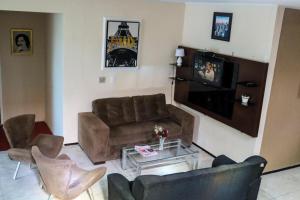 a living room with a couch and a coffee table at Hotel Nacional in Sobral