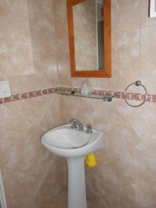 a bathroom with a sink and a mirror at Montalto in Dina Huapi