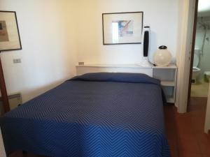 Appartamento Cala de Flores tesisinde bir odada yatak veya yataklar
