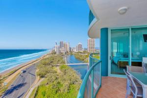 a balcony with a view of the ocean and a city at The Waterford on Main Beach in Gold Coast