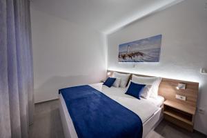 Ένα ή περισσότερα κρεβάτια σε δωμάτιο στο Villa Zora Lopar