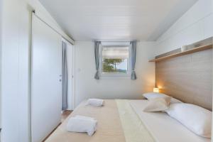 Voodi või voodid majutusasutuse Mobile house Nord 1 Laguna toas