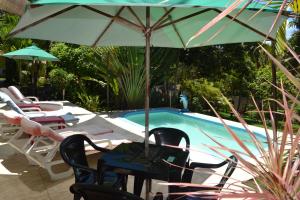 Bazén v ubytování Hotel Pousada Rancho Fundo nebo v jeho okolí
