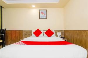 Postel nebo postele na pokoji v ubytování Hotel Arma Residency