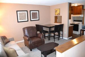 a living room with a couch and a table at Perfect Place in Grand Forks