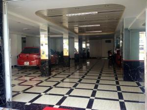 a parking lot with a car parked in a garage at Song Hung Hotel in Cà Mau
