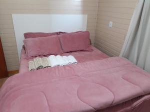 Cama o camas de una habitación en Chalé Vó Ivone