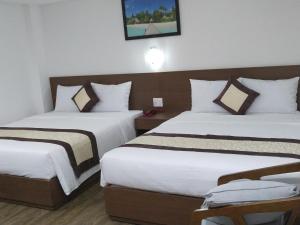 Postel nebo postele na pokoji v ubytování DORADO HOTEL