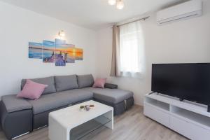 TV a/nebo společenská místnost v ubytování Villa Honey