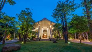a home with a lit up front yard at night at Borei Angkor Resort & Spa in Siem Reap