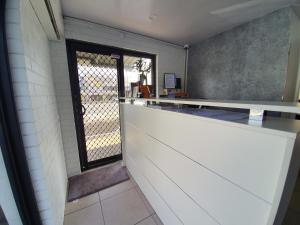 a kitchen with a counter and a window at Montego Mermaid Beach Motel in Gold Coast