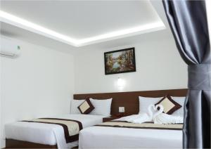 Postel nebo postele na pokoji v ubytování DORADO HOTEL + 17 fotografií