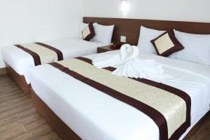 Postel nebo postele na pokoji v ubytování DORADO HOTEL
