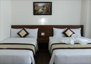 Postel nebo postele na pokoji v ubytování DORADO HOTEL