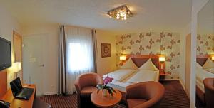 Postel nebo postele na pokoji v ubytování Hotel Nothwang