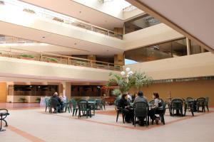 a group of people sitting at tables in a building at Best Western PLUS Plaza Florida & Tower in Irapuato