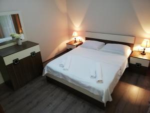 Postel nebo postele na pokoji v ubytování Guest House Lazika