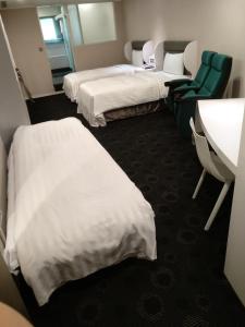 Postel nebo postele na pokoji v ubytování Ximen Airline Hotel