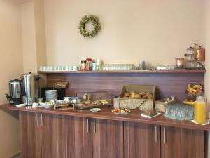 a buffet in a hotel room with food on it at Pension No. 55 in Erfurt