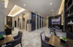 TV a/nebo společenská místnost v ubytování Shenyang Huaqiang Novlion Hotel