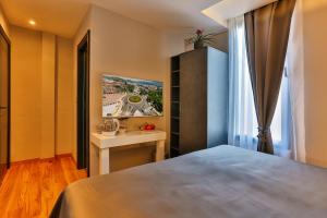 Postel nebo postele na pokoji v ubytování Hotel M