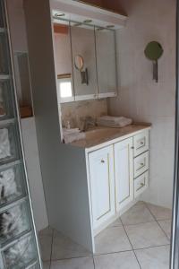 a bathroom with a sink and a mirror at les agnates in Flagey-Échézeaux