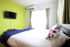 Letto o letti in una camera di Chura Minpaku Ishigaki