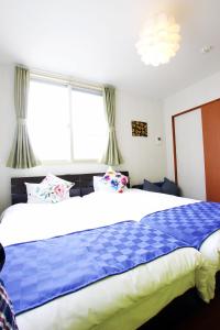 Letto o letti in una camera di Chura Minpaku Ishigaki