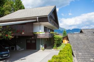 a house with a tv on the side of it at STUDIO LUNA in Bled